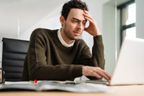 Man looking at a computer